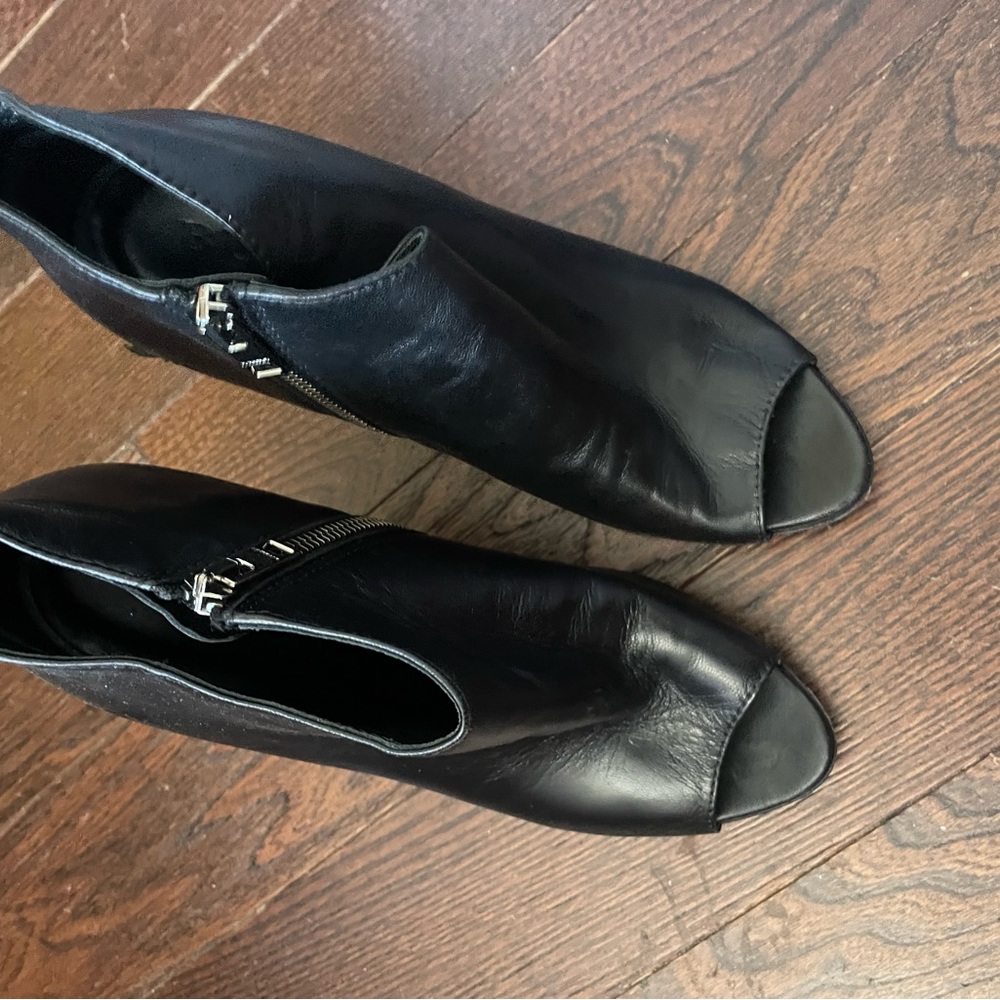 Black leather booties one has a scratch on infertility heal
